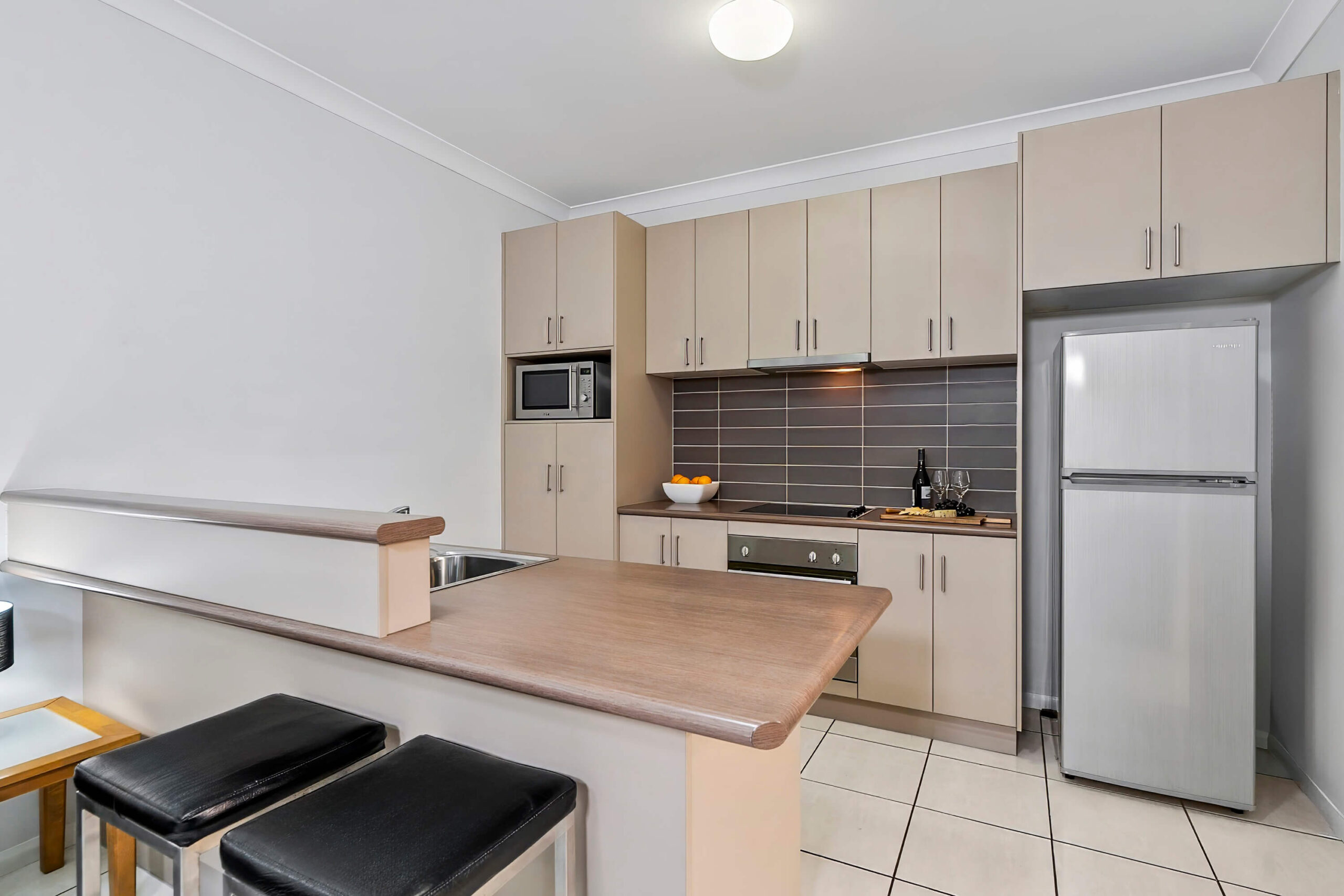Deluxe Apartment — Full kitchen with full-size fridge, stove top and oven